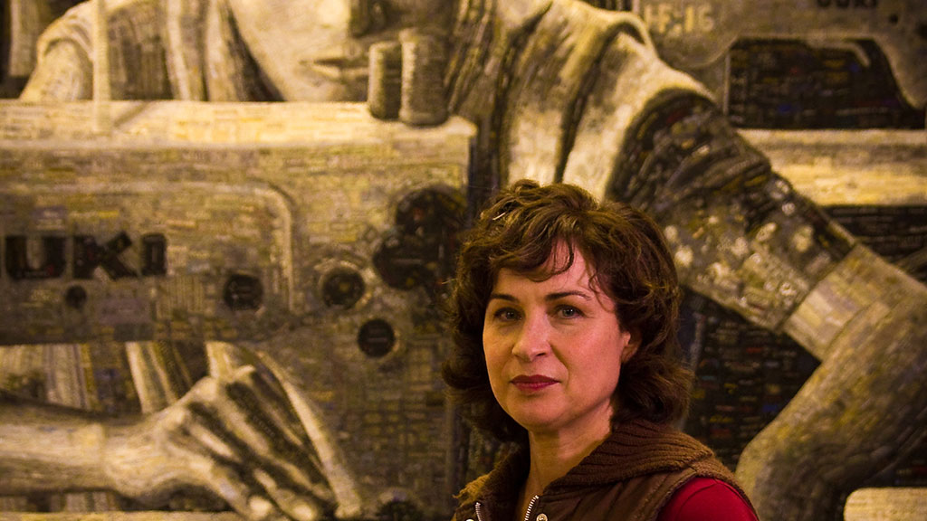 Terese Agnew with the Portrait of a Textile Worker. Mark Markley photograph