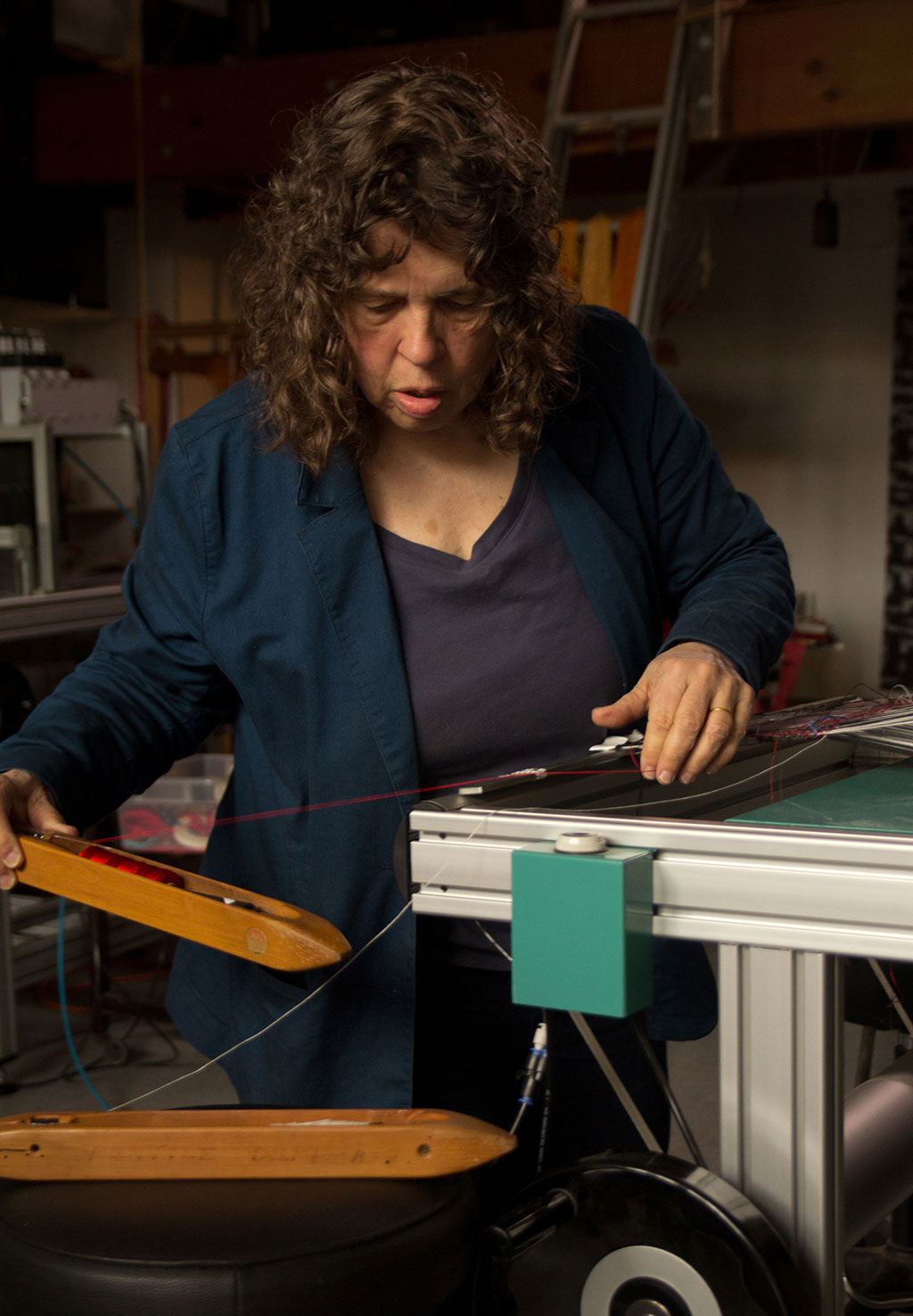 Lia Cook at the loom. Mark Markley photograph