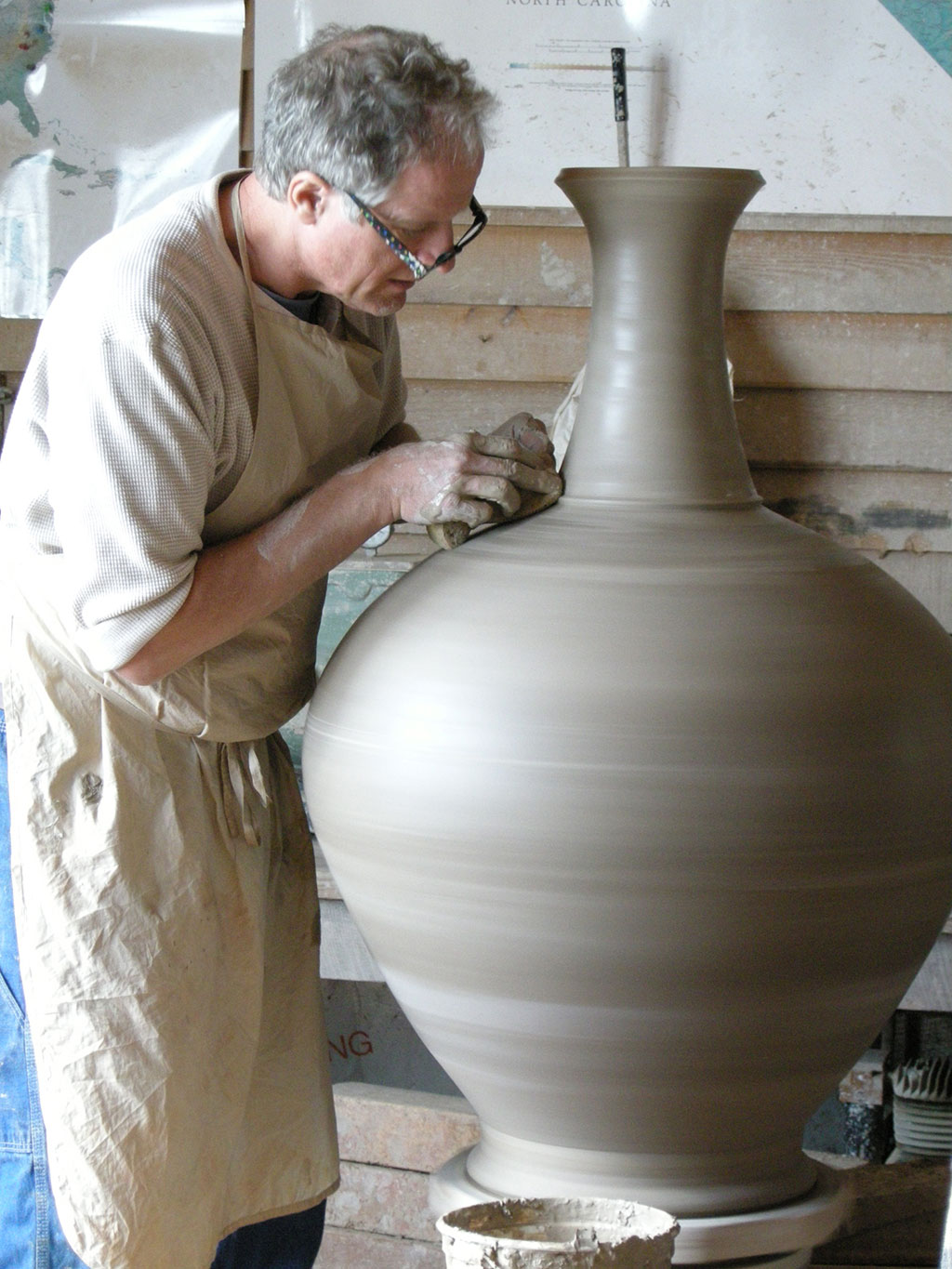 Mark Hewitt, Potter, in his studio turning clay