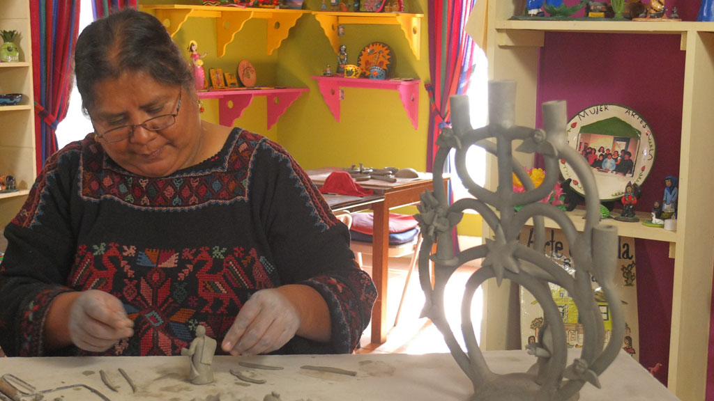 Veronica Castillo makes a Tree of Life. Mark Markley photograph, Craft in America