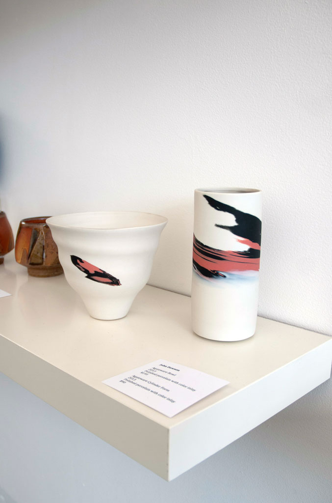 John Dawson, Agateware Bowl and Agateware Cylinder form, 2013. Polished porcelain with color inlay, Madison Metro photograph