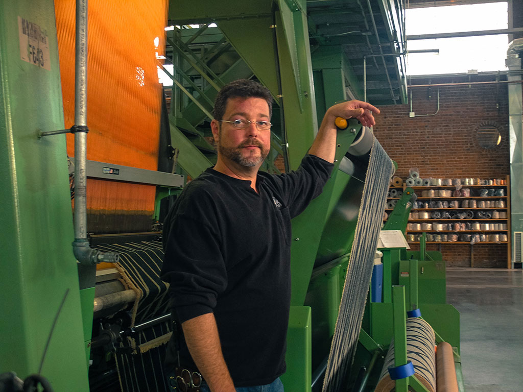 Loom overhauler Barry Connor operates the looms at The Oriole Mill