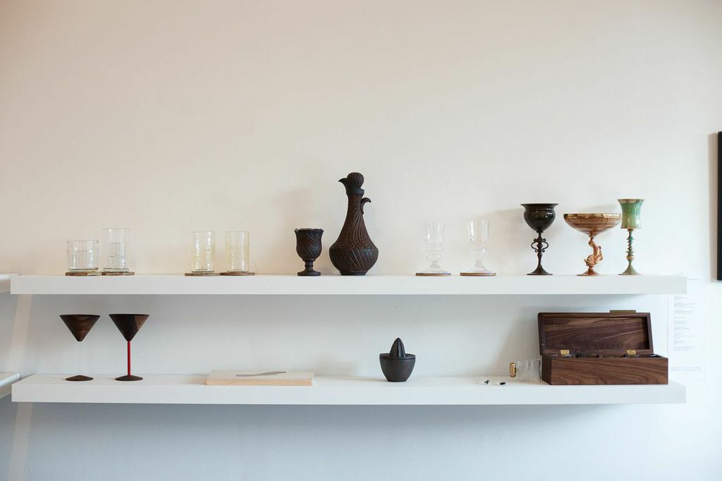 (top, l-r) Nate Cotterman, Low Ball and High Ball Cube Glasses; James Vella, Collins Glasses; A. Blaire Clemo, Decanter and Cup; James Vella, Absinthe Glasses; Wyatt Amend, Emerald Cup, Venetian Dolphin and Blue + Gold Cup; Bari Ziperstein, Hexagon and Finnish Coasters. (bottom, l-r): David Rasmussen Design, Wood Martini Glass, black walnut and acrylic; Treeline Woodworks, Golden State Cutting Board, reclaimed wood; Lindsay Oesterritter, Juicer, iron-rich stoneware, wheel thrown press mold, woodfired; Neptune Glassworks, Glass Stir Sticks, glass; Conveyor Cups with Walnut Box, blow-molded and hand finished glass with brass handle and walnut