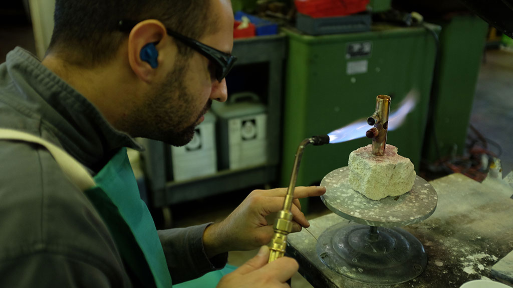 Kyle Ostwalt solders a valve casing. Mark Markley photograph