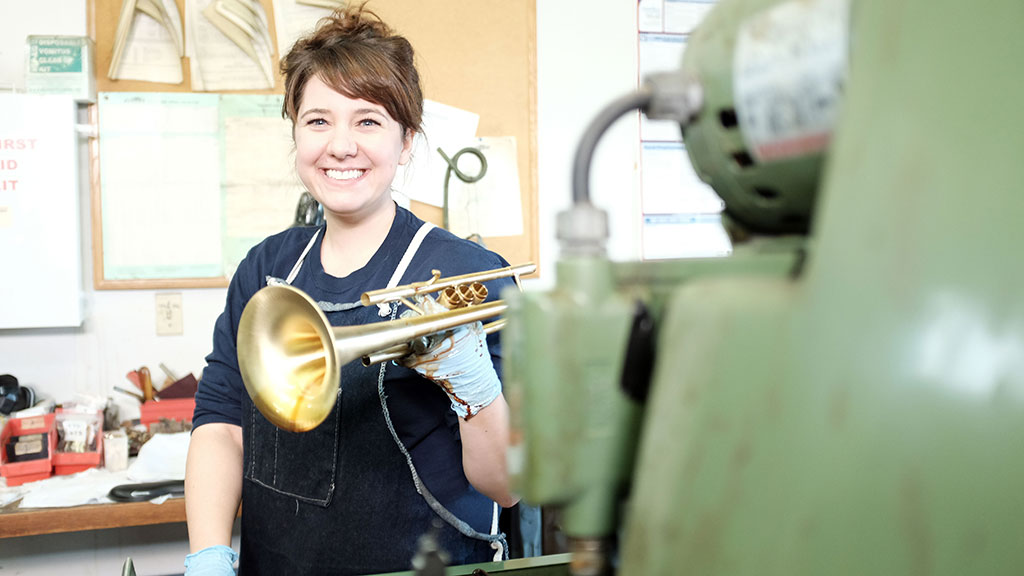 Heather Sessler holds a finished Monette trumpet. Mark Markley photograph