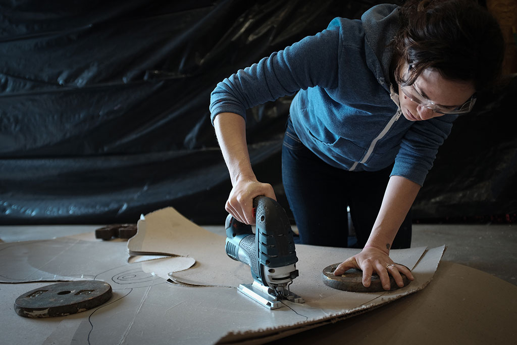 Stephanie Mufson cutting out a template