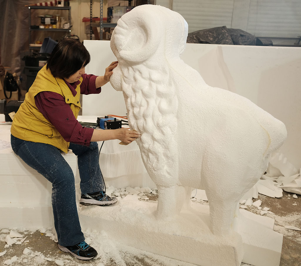 Yumei Hou sculpting a sheep