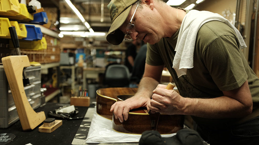 Todd Garrity adjusts the body for a perfect neck fit. Mark Markley photograph