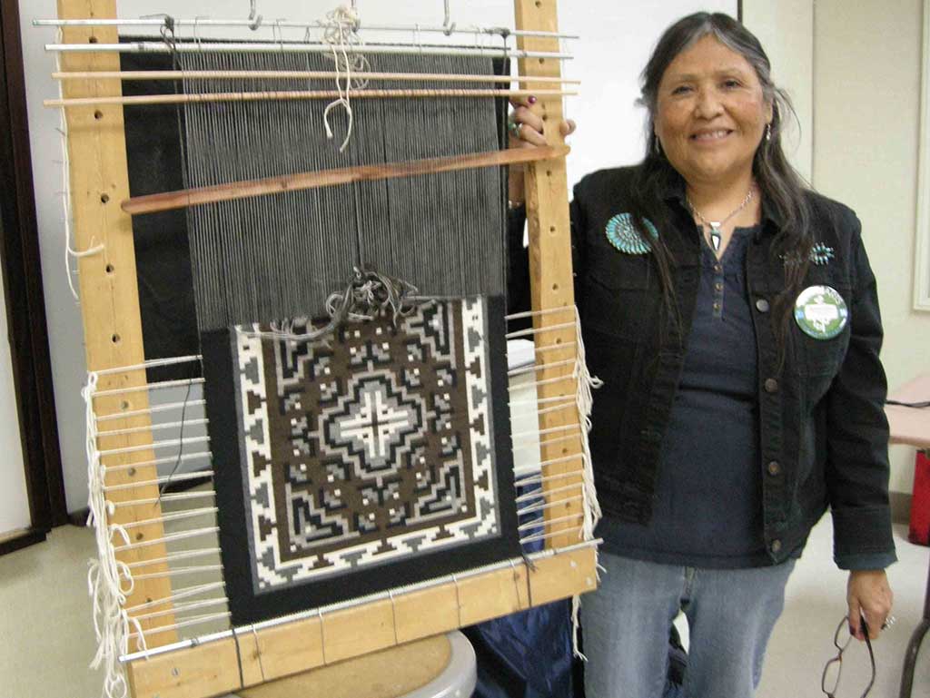 Barbara Teller Ornelas with her weaving in process