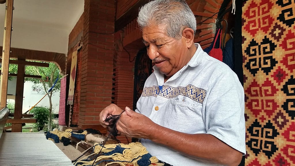 J. Isaac Vásquez García, master weaver and dyer, is featured in the Craft in America: Borders episode. Photo by Denise Kang