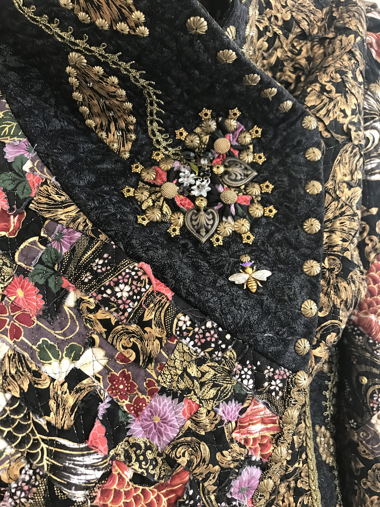 Kathy Knapp, Gothic Beauty, 2018. Cotton textiles, silk batting, metallic threads, bracelet pieces, bee charm, brass closures, buttons, non-traditional metallic beads, Swarovski crystals, galloon ribbon, and French trim. Excellence in Fibers IV