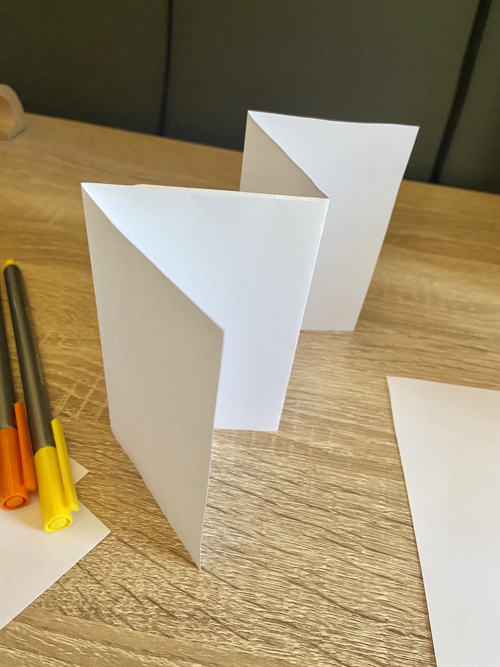 Flip over the paper and do the same fold. Your paper should now look like a W.
