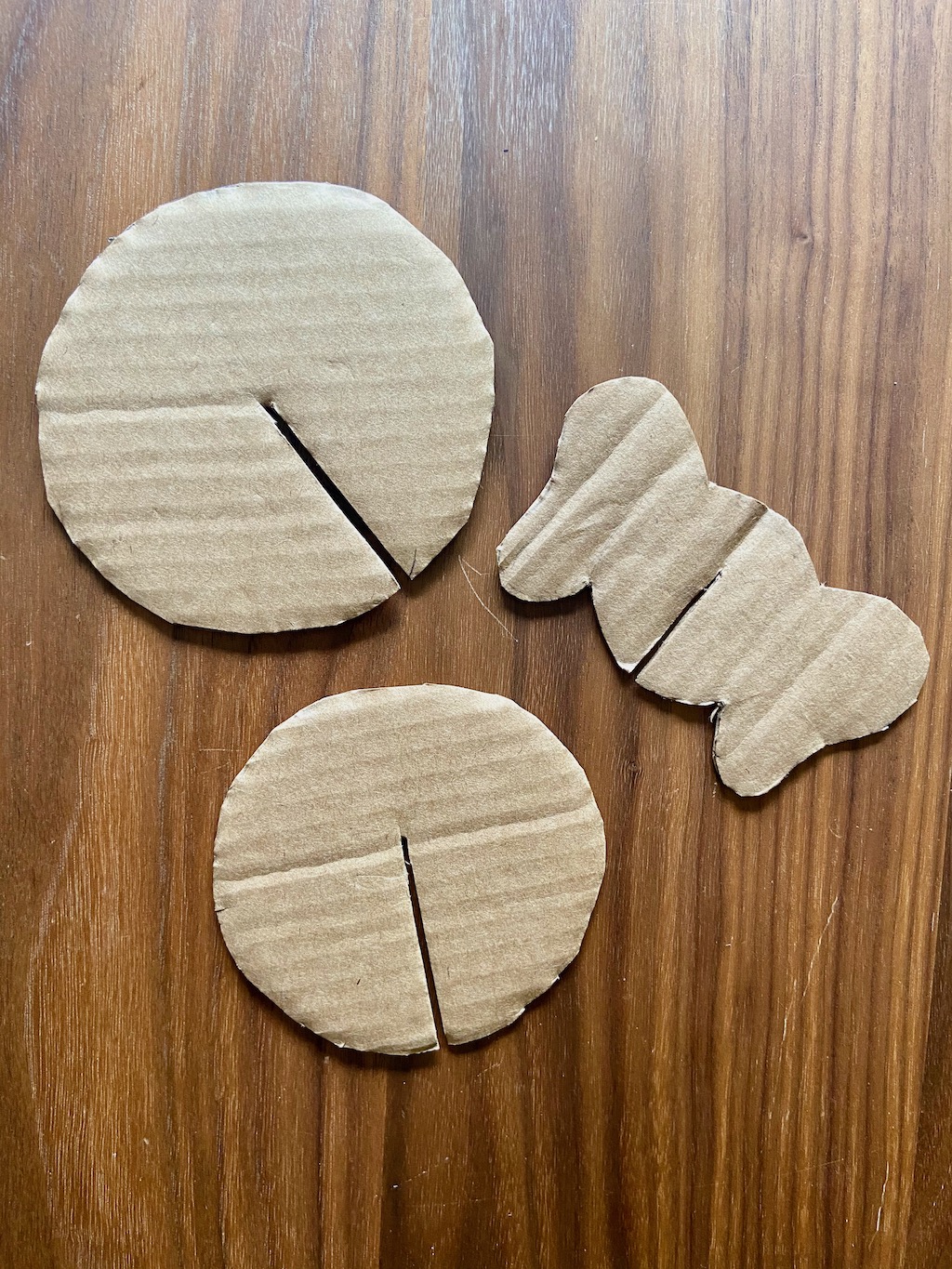 Cut all of these shapes out of the clean cardboard. You will have: 2 body circles, 1 head (with ears!)