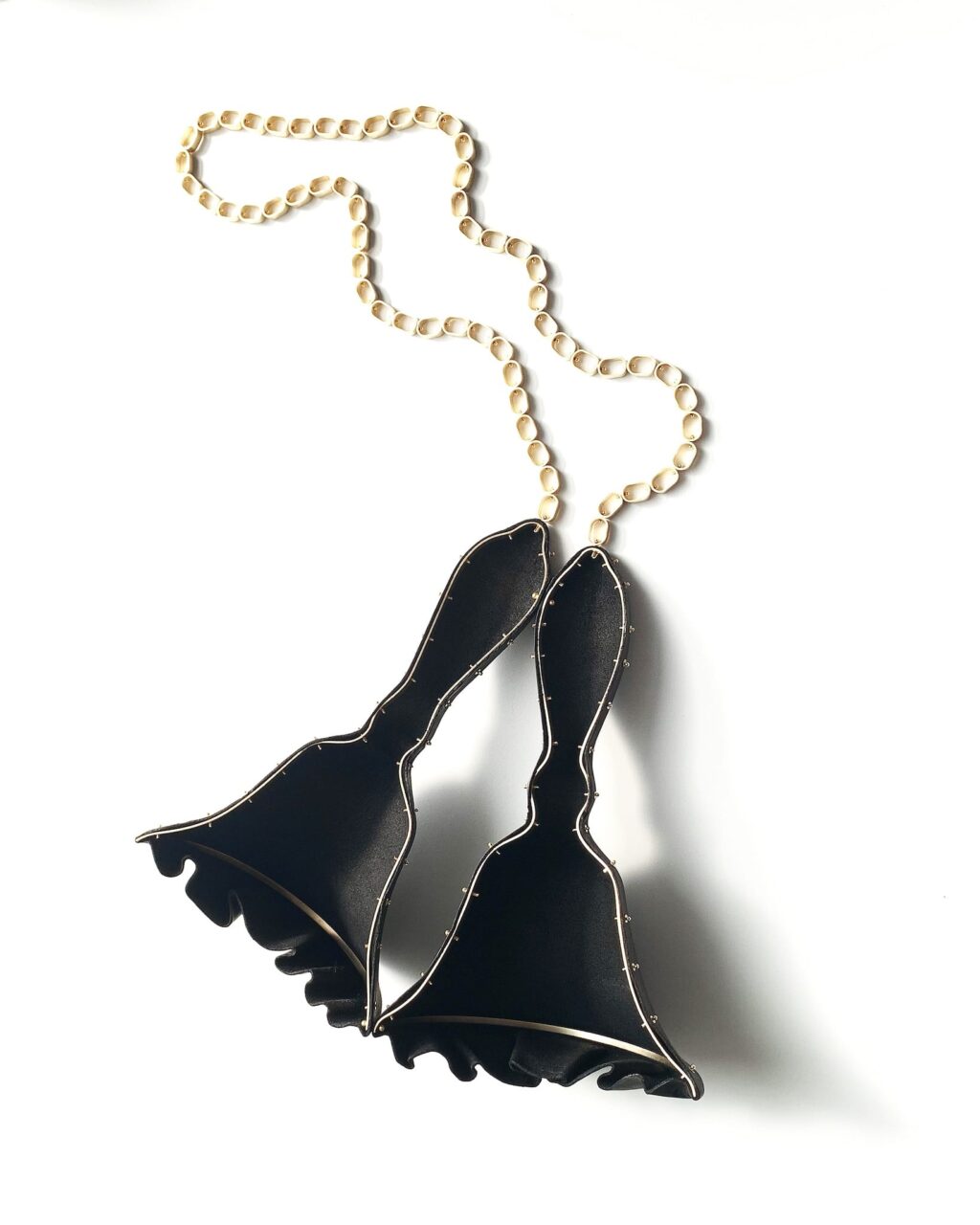 Kerianne Quick, Rags to firmly ensconced in a middle class life: peddlers bell necklace, Craft in America