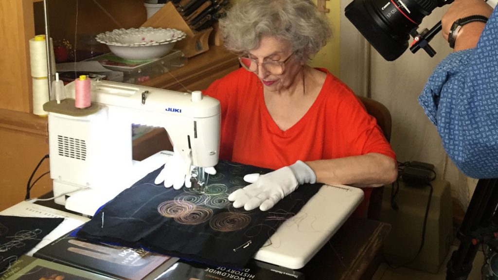 Fiber artist Linda J. Mendelson at the sewing machine. Craft in America STORYTELLERS