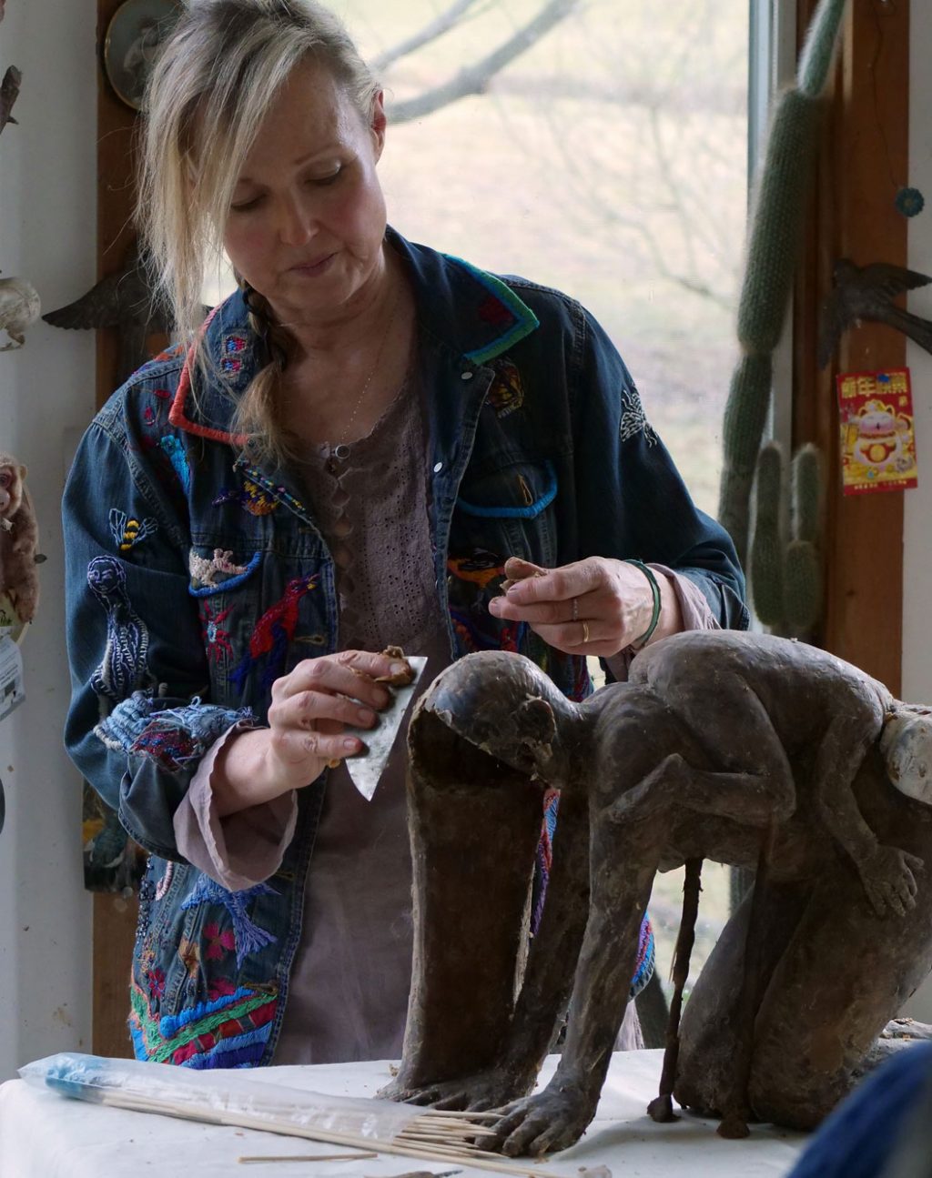 Artist Christina Bothwell works in wax to create a mold to fill with glass. Craft in America STORYTELLERS