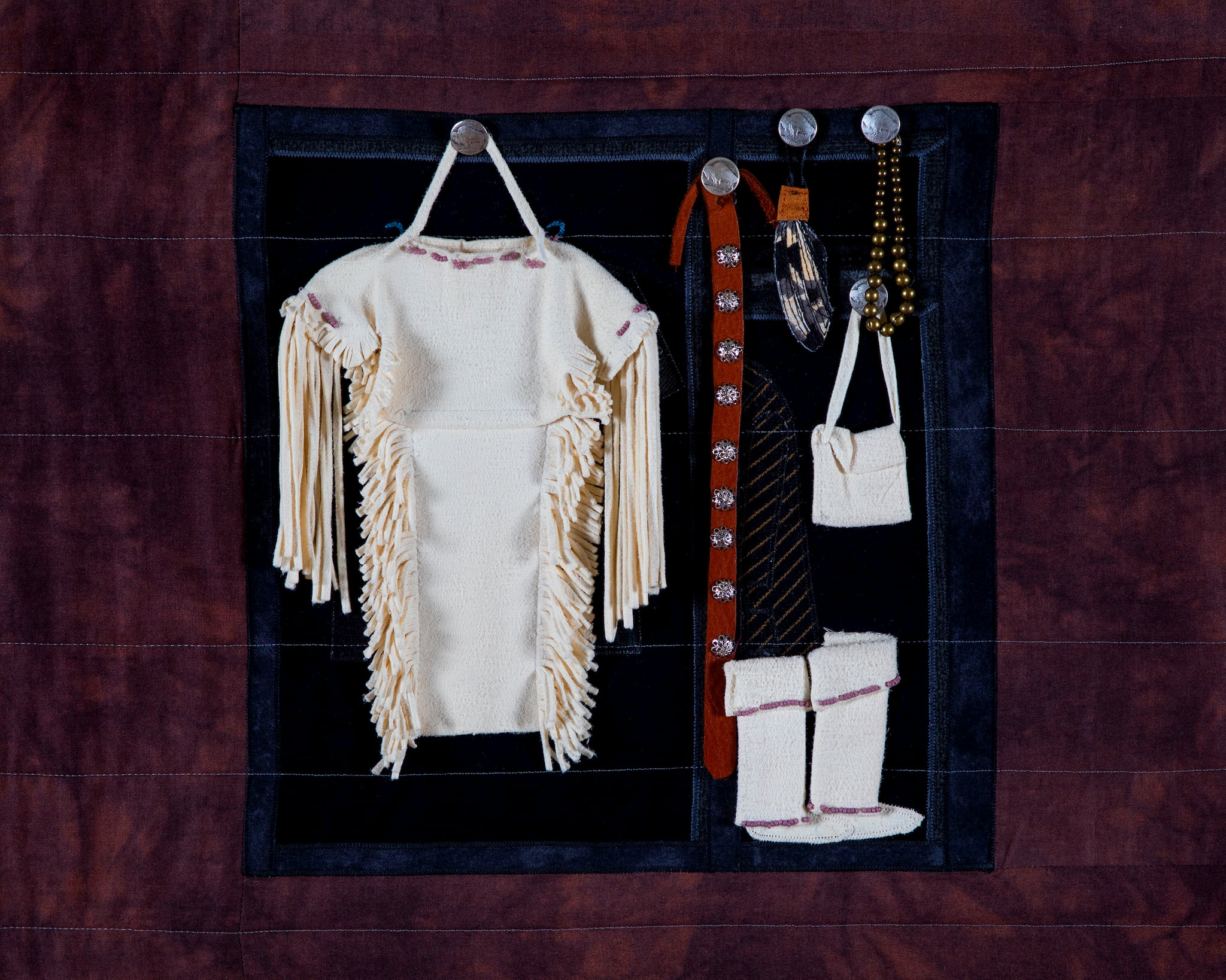 Susan Hudson, MMIW Since 1492, 2018. Cotton fabric, batting, thread, commercial buttons, leather; 94 x 54 x 1/2" Image courtesy of the artist. Photograph by Tad Fruits. Craft in America Center Democracy