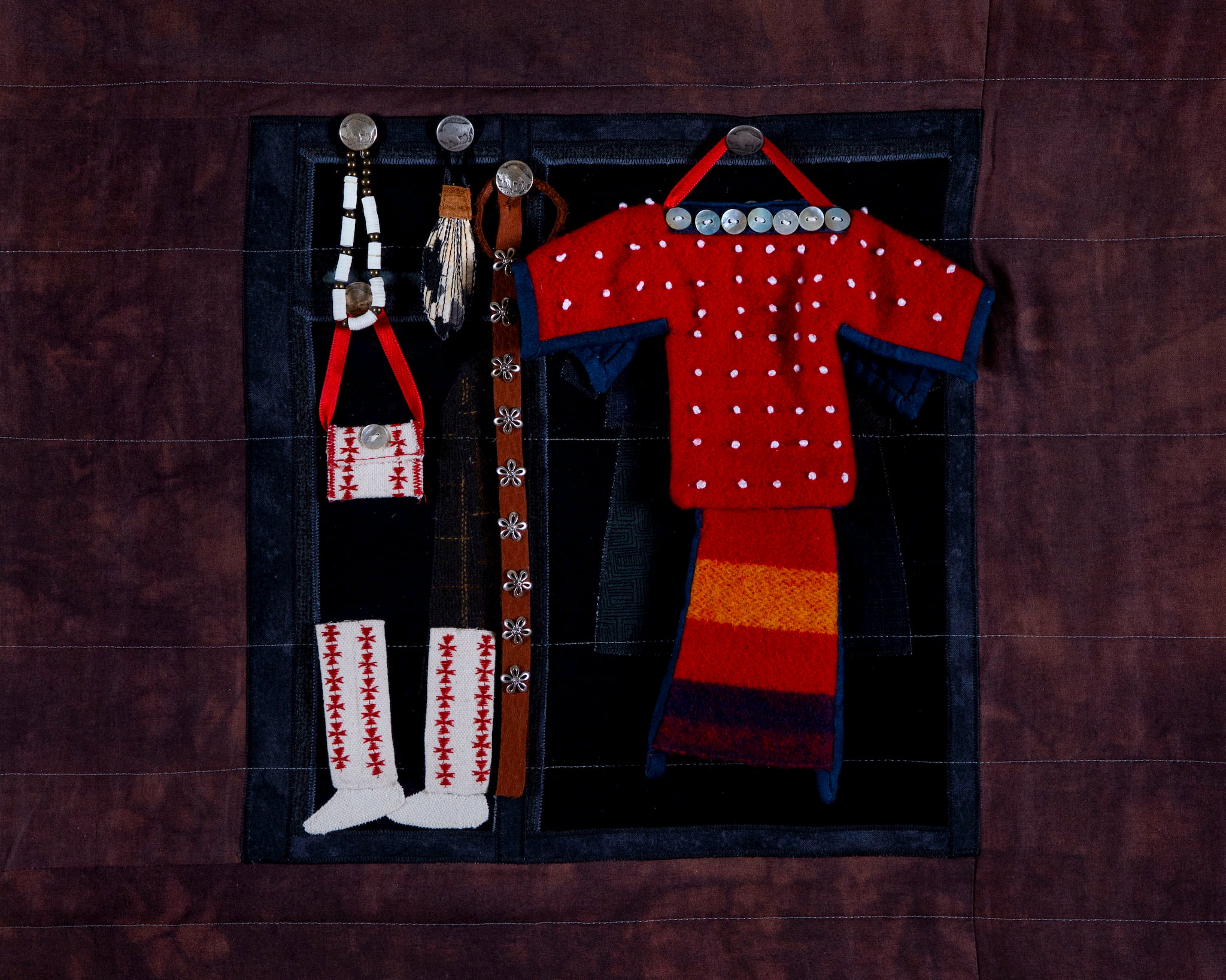 Susan Hudson, MMIW Since 1492, 2018. Cotton fabric, batting, thread, commercial buttons, leather; 94 x 54 x 1/2" Image courtesy of the artist. Photograph by Tad Fruits. Craft in America Center Democracy