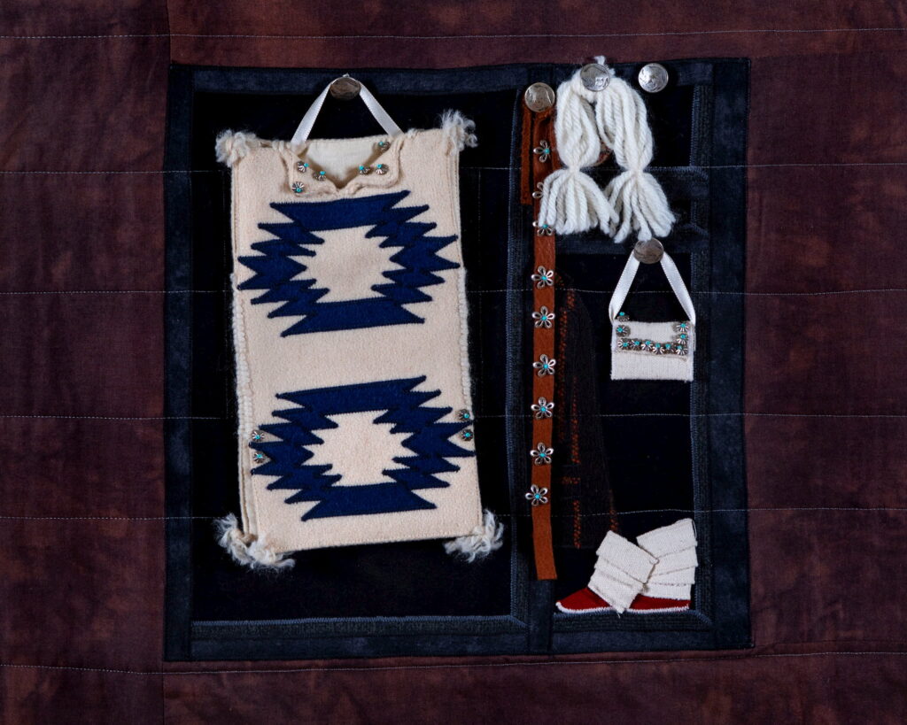 Susan Hudson, MMIW Since 1492, 2018. Cotton fabric, batting, thread, commercial buttons, leather; 94 x 54 x 1/2" Image courtesy of the artist. Photograph by Tad Fruits. Craft in America Center Democracy