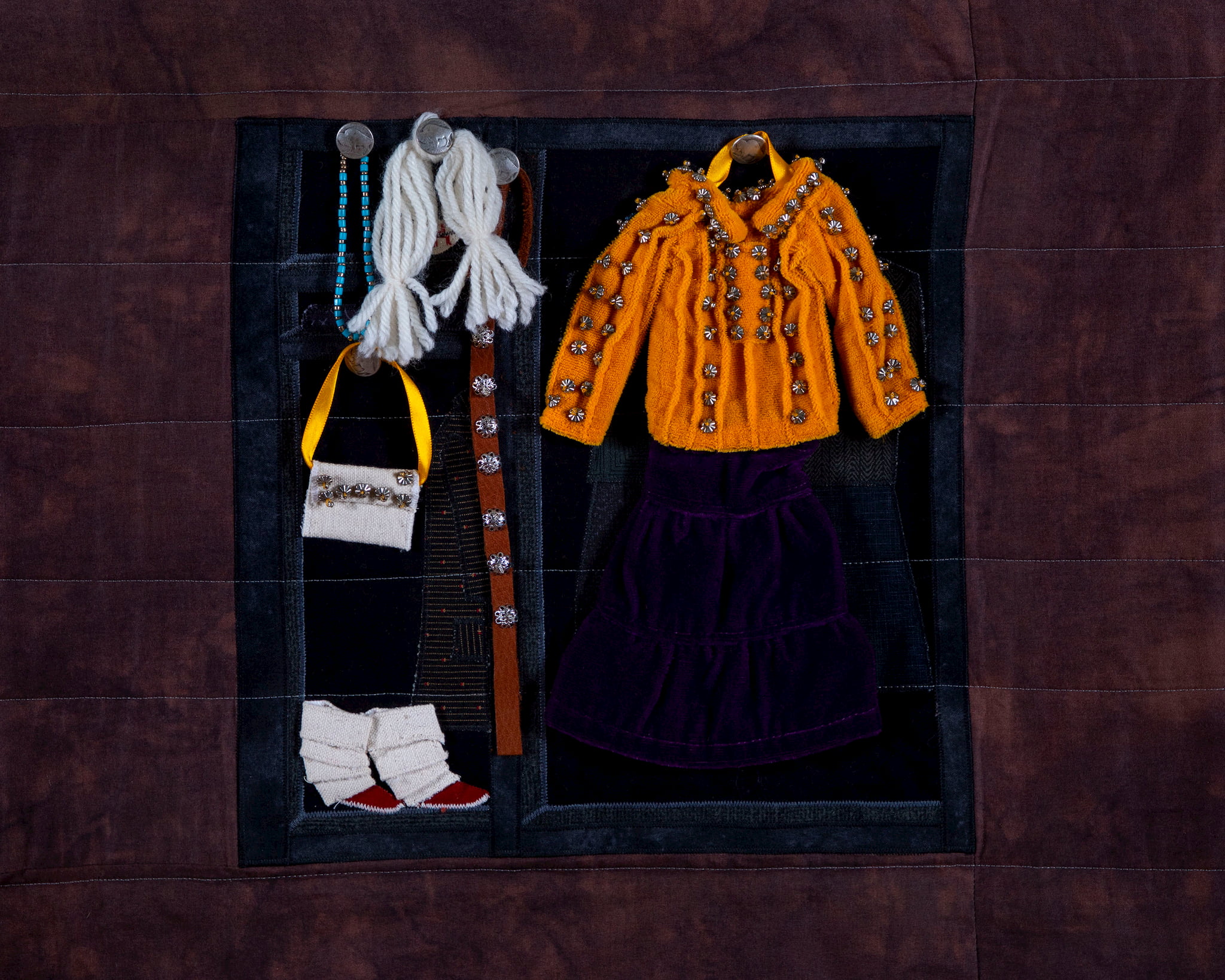 Susan Hudson, MMIW Since 1492, 2018. Cotton fabric, batting, thread, commercial buttons, leather; 94 x 54 x 1/2" Image courtesy of the artist. Photograph by Tad Fruits. Craft in America Center Democracy