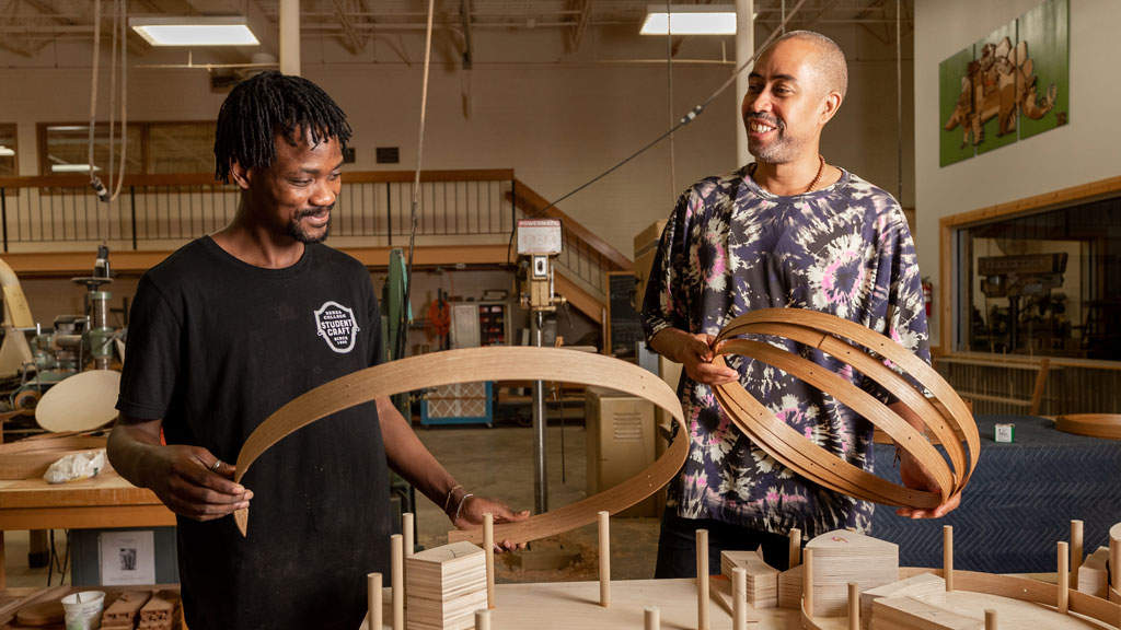 Stephen Burks with Berea college student Joseph Tayo Opaleye. Courtesy of Berea College. Craft in America Democracy