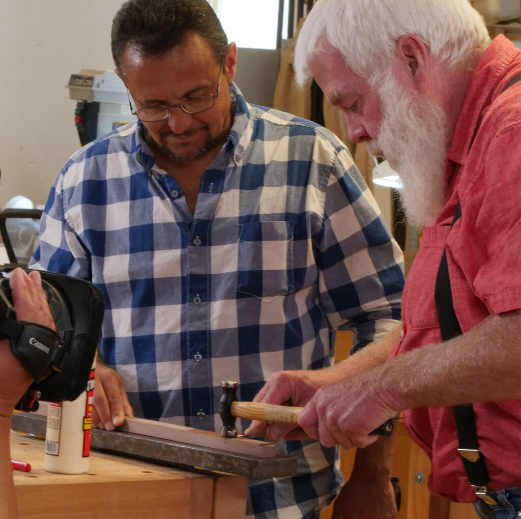 Instructor Paul Williams assists student at the Appalachian School of Luthiery’s Culture of Recovery program in Hindman, Kentucky. Denise Kang photo. HARMONY episode of Craft in America