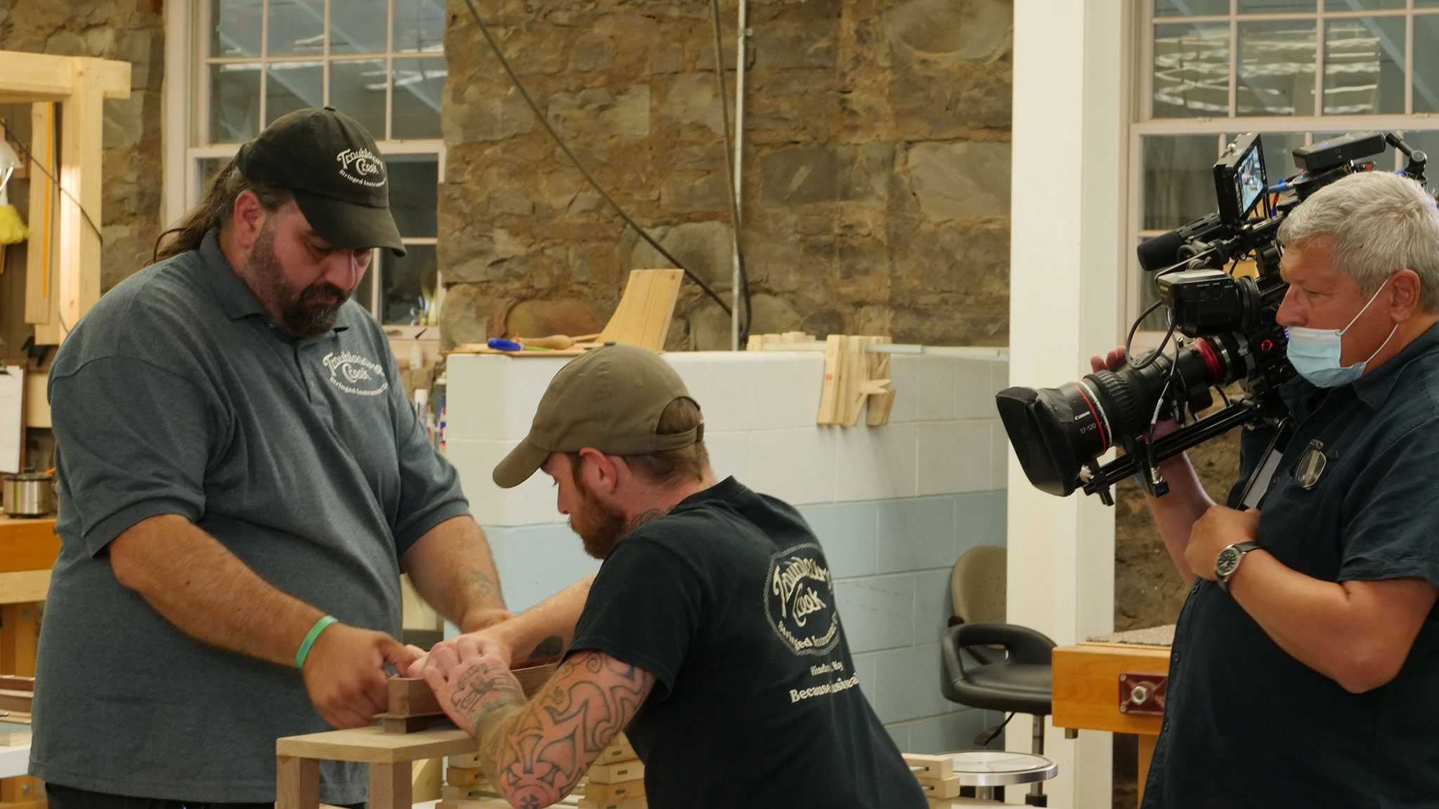 Luthiers Nathan Smith and Jeremy Haney work together to build a mountain dulcimer at the Troublesome Creek Stringed Instrument Company in Hindman, Kentucky. Denise Kang photo. HARMONY episode of Craft in America