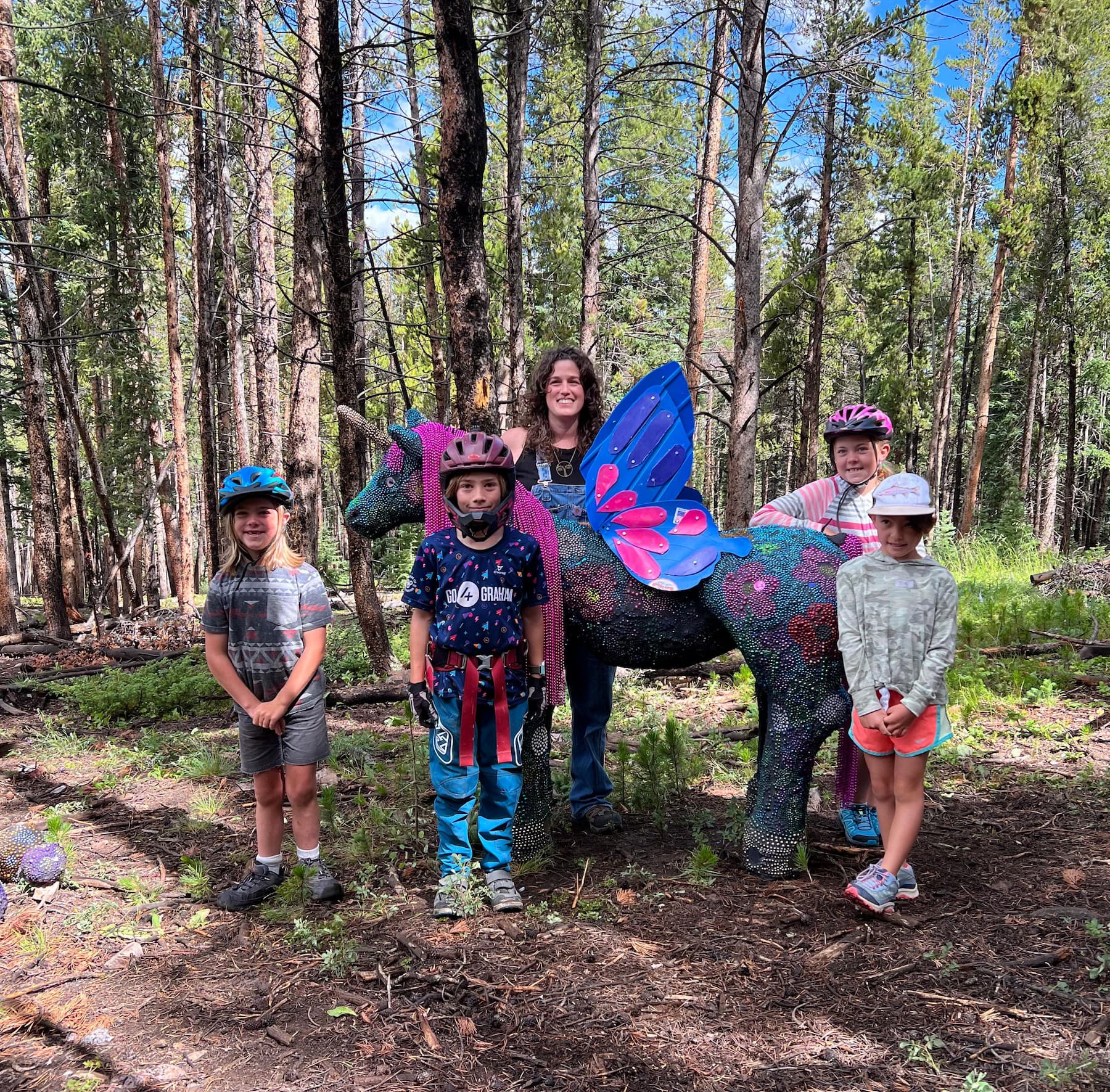 Calder Kamin with her unicorn installation, PLAY, Craft in America