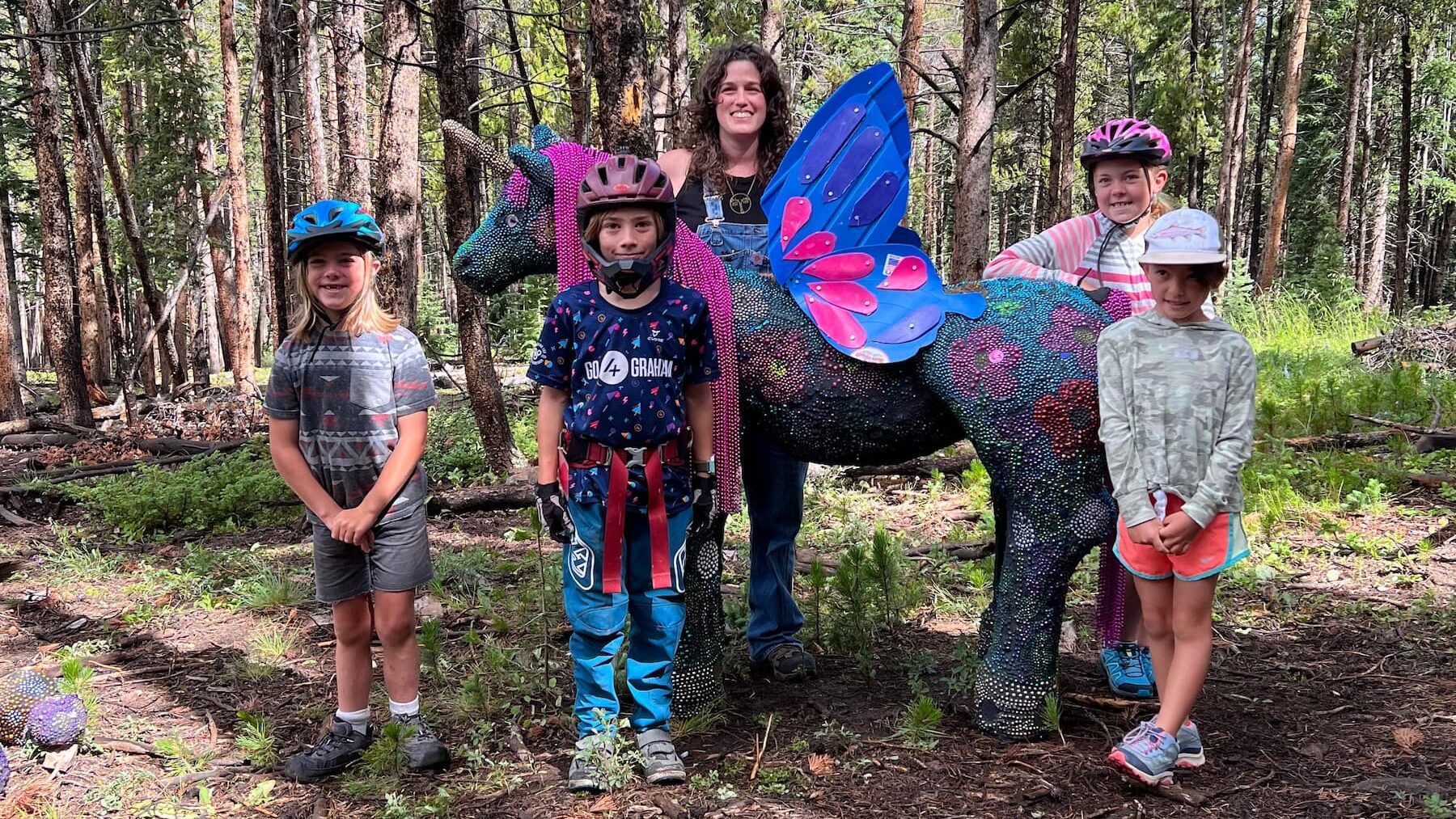 Calder Kamin with her unicorn installation, PLAY, Craft in America