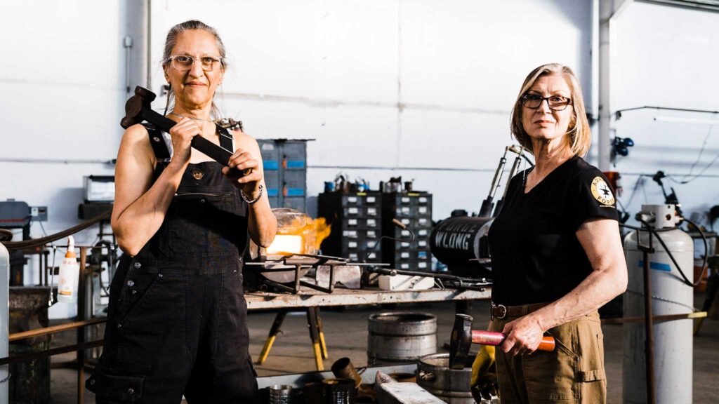 Heather McLarty (left), Mary Jane Verniere (right) in the blacksmithing studio