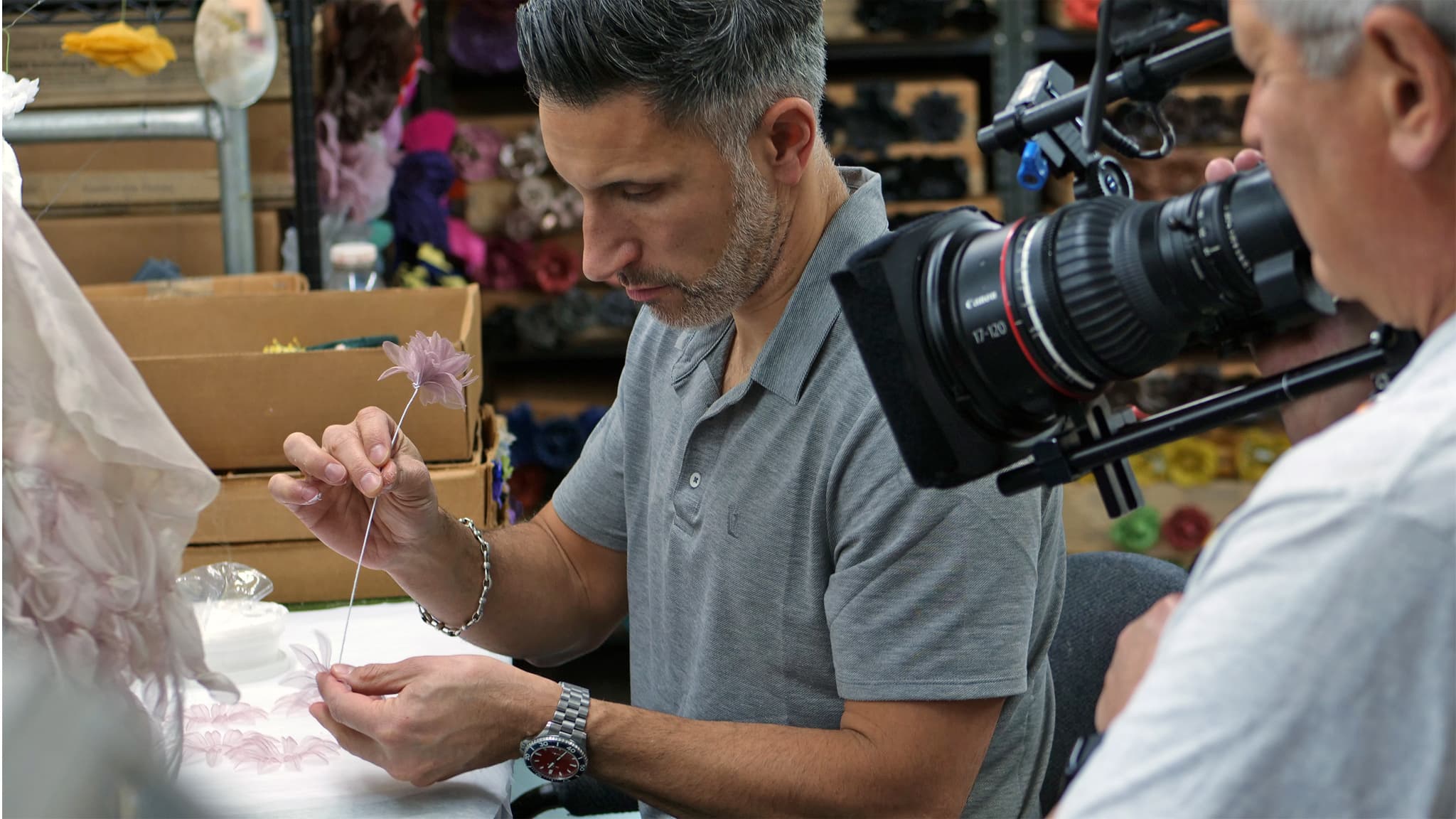 M&S Schmalberg Vice President Adam Brand makes a flower, Denise Kang photograph Craft in America