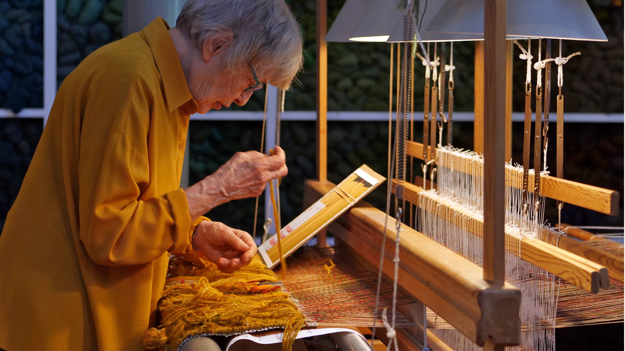 Weaver Helena Hernmarck at the loom, Denise Kang photograph Craft in America