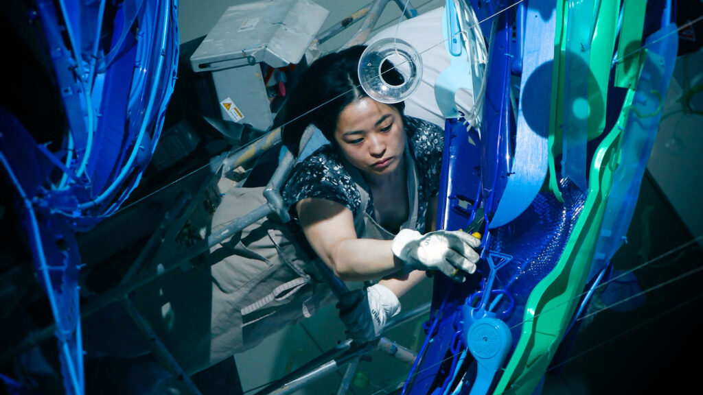 Sayaka Ganz installing Embrace, courtesy of the artist, Adam Parsons photograph