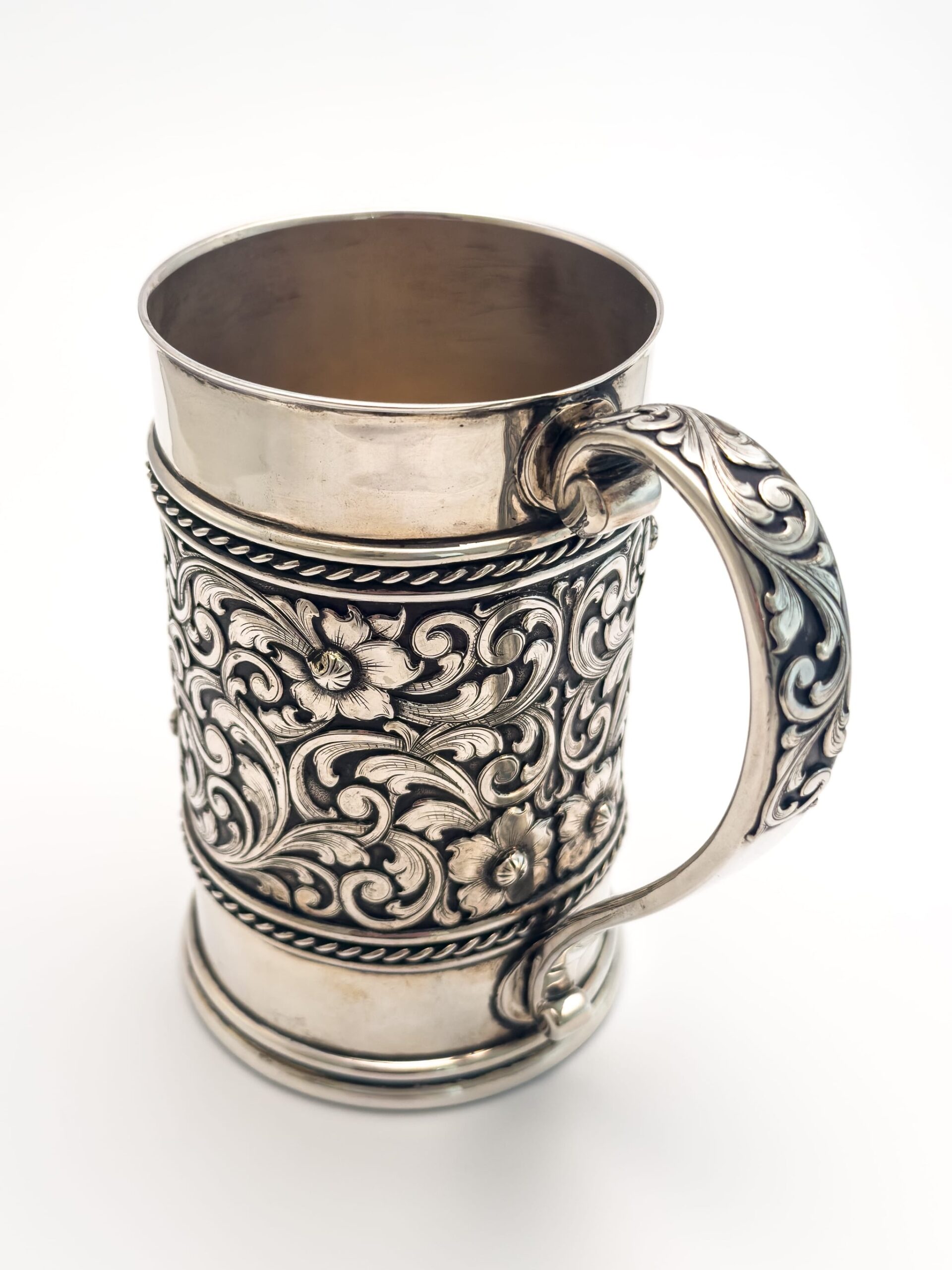 An ornate engraved silver stein