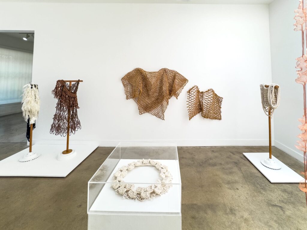 A wide shot of Marques Hanalei Marzan's Entwine showing 6 of the works in the exhibition