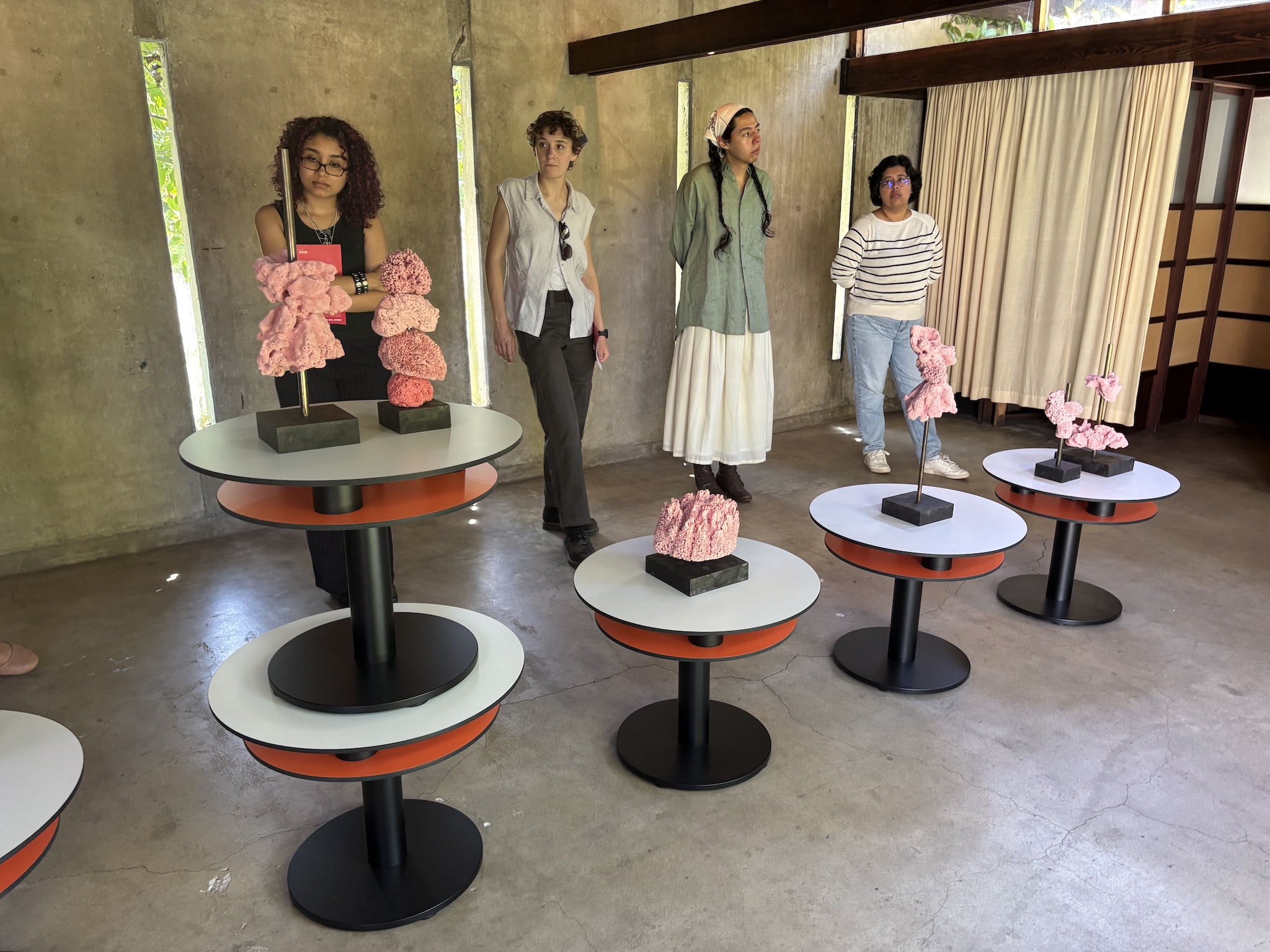 A group of getty interns standing around an exhibit at the MAK Center