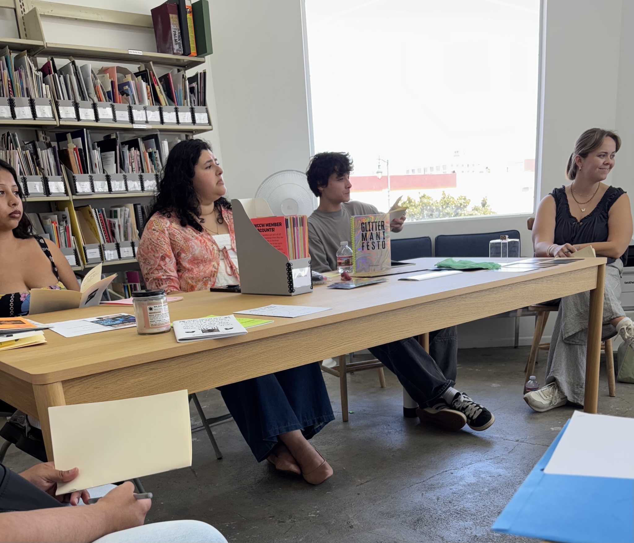 A group of Getty interns sitting at a table at Los Angeles Contemporary Archives