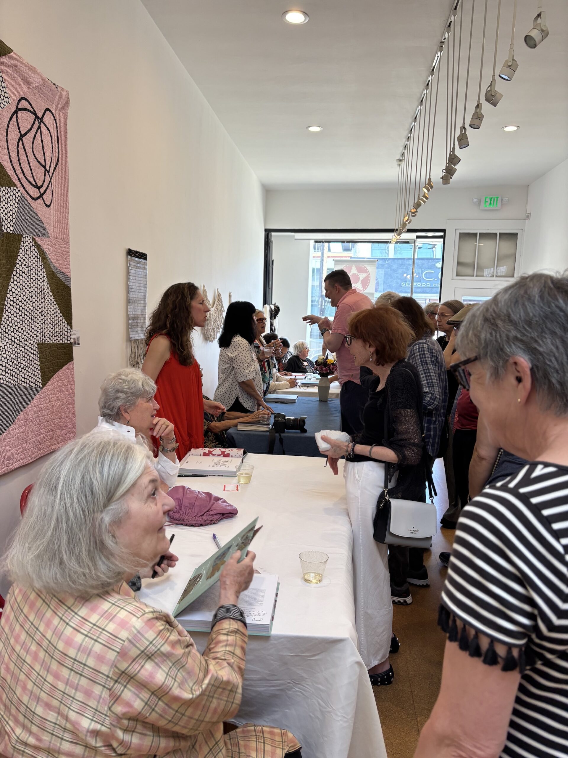 A view of the crowded center during the book signing event