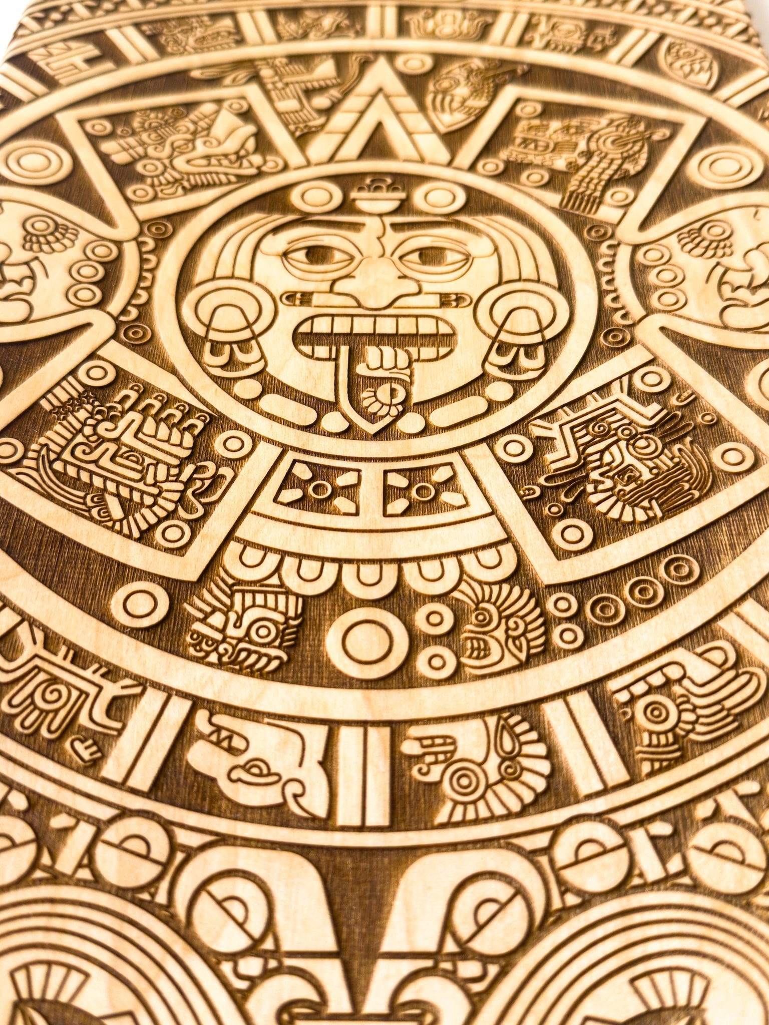 Craft in America Center, Manny Torres, Sun Stone #1, Laser Etched Skate Deck, detail, 2025, vehicles of expression